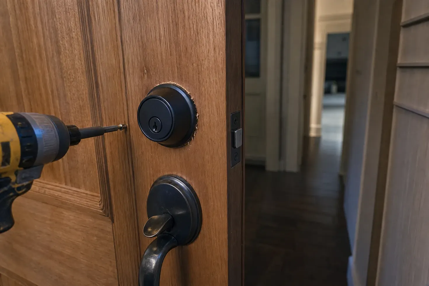 New deadbolt being installed in a front door